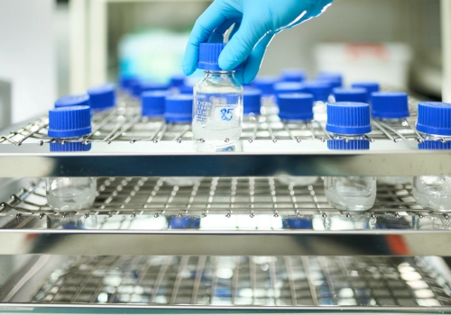 A vial is grabbed in the lab